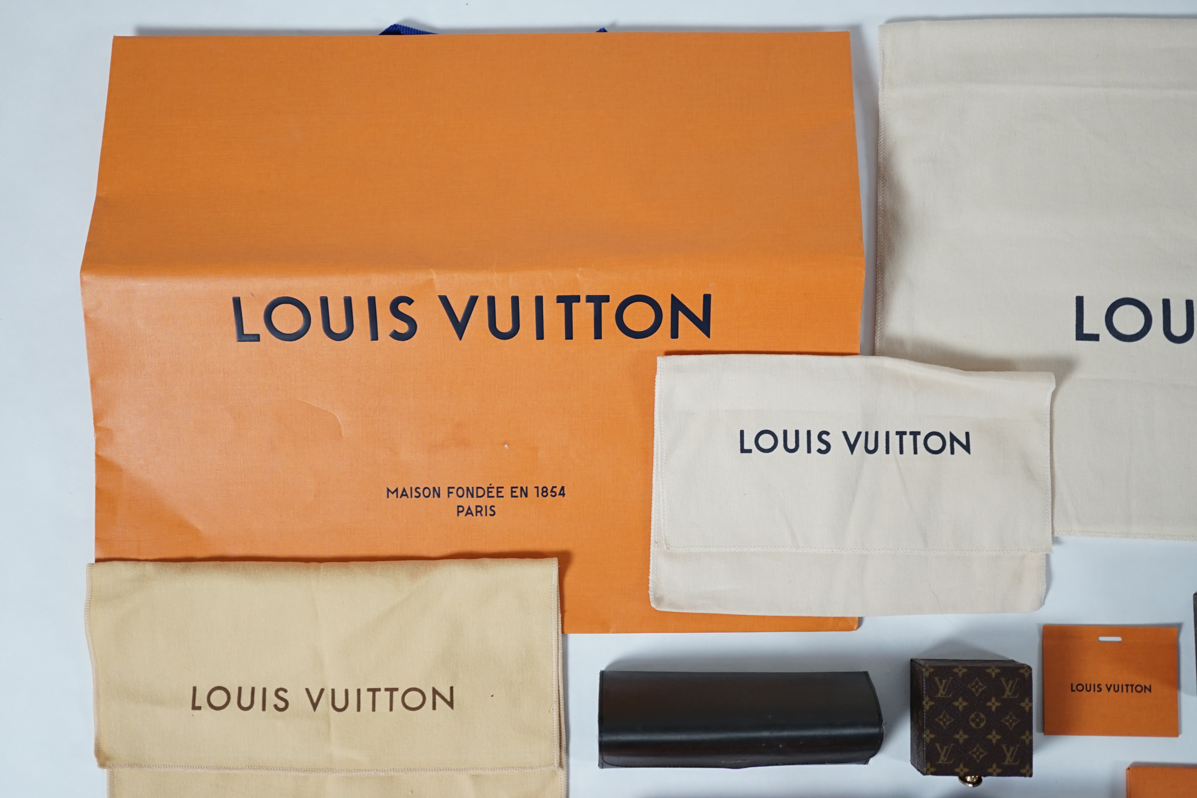 A selection of empty designer boxes including Cartier, Louis Vuitton and Chopard